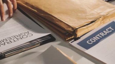 contract on wooden table.