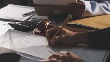 close up of male lawyer 's hand making notes