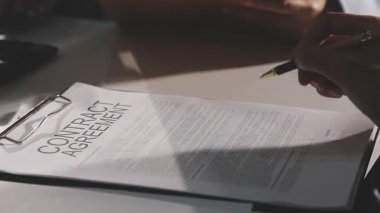 close up view of businessman signing contract