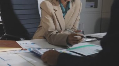 young asian business people are discussing business project in the office.