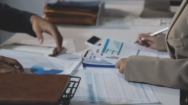business man analyzing charts in his office