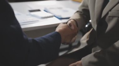 handshake of business partners at the meeting in the workplace