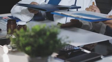 close - up of doctors working on a computer at the hospital