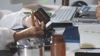 close up view of a professional designer working on his laptop and making a new design.