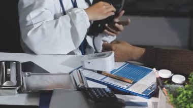 close up of doctor hand using digital tablet for medical examination.