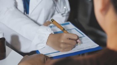 doctor and patient discussing and consulting with medical history. healthcare and medicine concept.