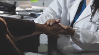 close up view of doctors hands holding a stethoscope