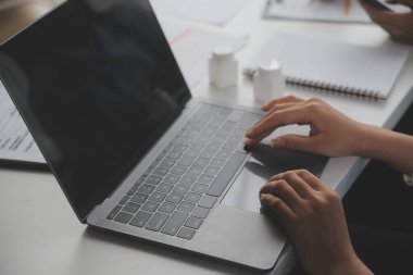 Doctors, nurse or laptop in night teamwork, medical research or surgery planning in wellness hospital. Talking, thinking or healthcare women on technology for collaboration help or life insurance app