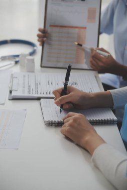 Doctors, nurse or laptop in night teamwork, medical research or surgery planning in wellness hospital. Talking, thinking or healthcare women on technology for collaboration help or life insurance app