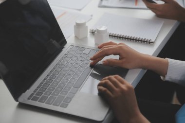 Doctors, nurse or laptop in night teamwork, medical research or surgery planning in wellness hospital. Talking, thinking or healthcare women on technology for collaboration help or life insurance app