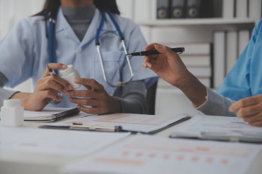 Doctors, nurse or laptop in night teamwork, medical research or surgery planning in wellness hospital. Talking, thinking or healthcare women on technology for collaboration help or life insurance app