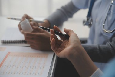 Doctors, nurse or laptop in night teamwork, medical research or surgery planning in wellness hospital. Talking, thinking or healthcare women on technology for collaboration help or life insurance app