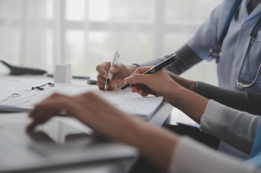 Doctors, nurse or laptop in night teamwork, medical research or surgery planning in wellness hospital. Talking, thinking or healthcare women on technology for collaboration help or life insurance app