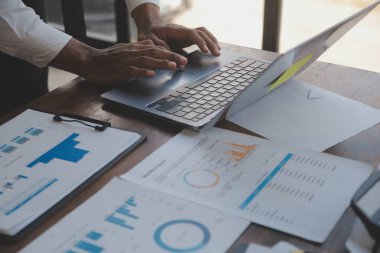 Business team meeting present.professional investor working with Finance managers task. with digital tablet,smartphone and laptop at modern office