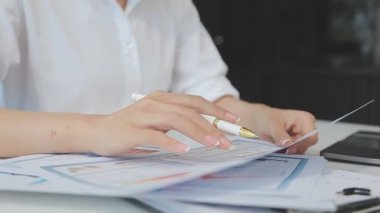 business woman hand holding document in office.