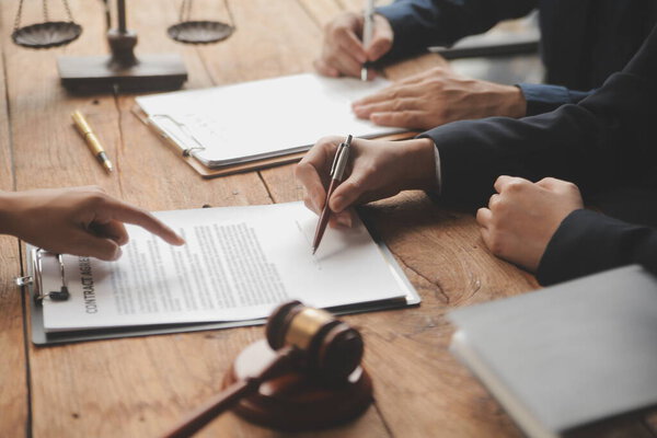 Good service cooperation, Consultation of Businesswoman and Male lawyer or judge counselor having team meeting with client, Law and Legal services concept.