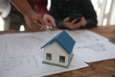 Diverse Team of Specialists Use Laptop on Construction Site. Real Estate Building Project with Engineer Investor and Businessman Checking Area, working on Civil Engineering, Discussing Strategy Plan