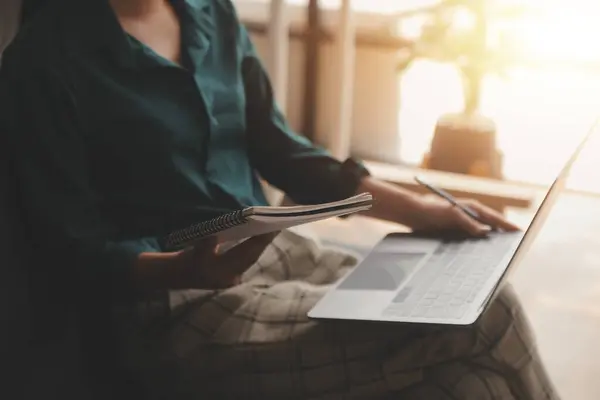 stock image Distracted from work worried young woman sitting on couch with laptop, thinking of problems. Pensive unmotivated lady looking at window, feeling lack of energy, doing remote freelance tasks at home.