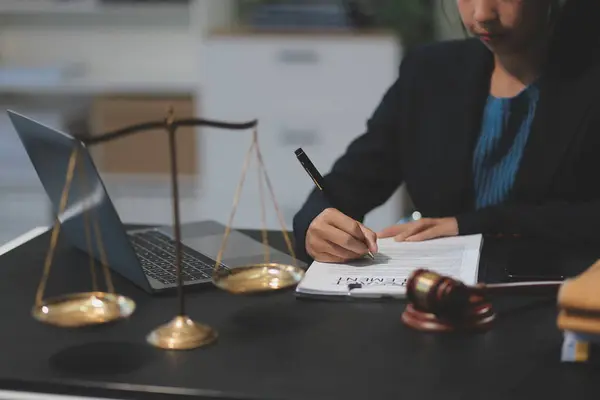 female business woman lawyers working at the law firms. Judge gavel with scales of justice. Legal law, lawyer, documents, advice and justice concept.