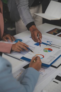 Close up of Business team analyzing income charts and graphs with modern laptop computer. Business analysis and strategy concept.