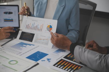 Close up of Business team analyzing income charts and graphs with modern laptop computer. Business analysis and strategy concept.
