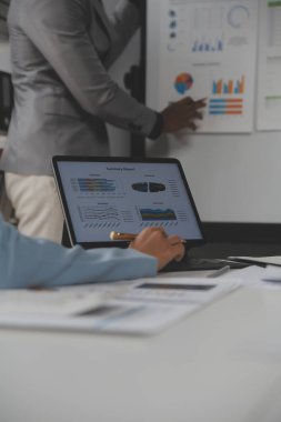 Close up of Business team analyzing income charts and graphs with modern laptop computer. Business analysis and strategy concept.