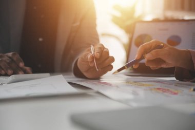 Close up of Business team analyzing income charts and graphs with modern laptop computer. Business analysis and strategy concept.