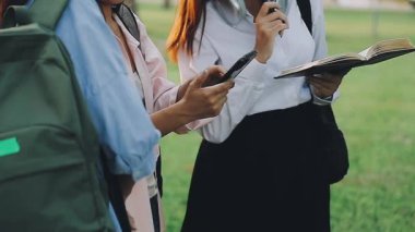 young woman in white dress with a book in the park
