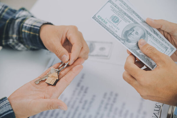 Real estate agent and customer signing contract to buy house, insurance or loan real estate.rent a house,get insurance or loan real estate or property.