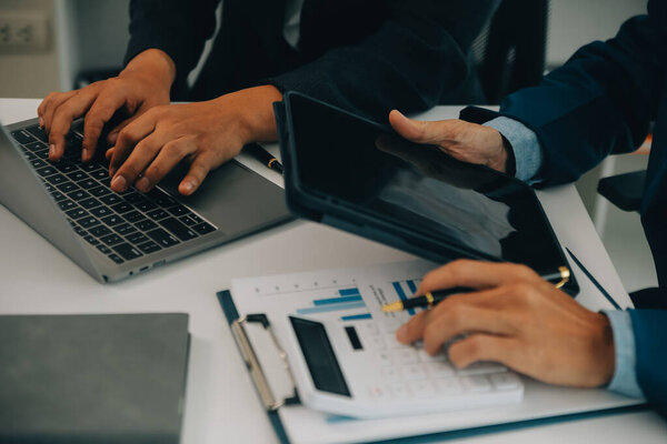 Team of business people are meeting to analyze data for marketing plan,Market research reports and income statistics, Financial and Accounting concept.