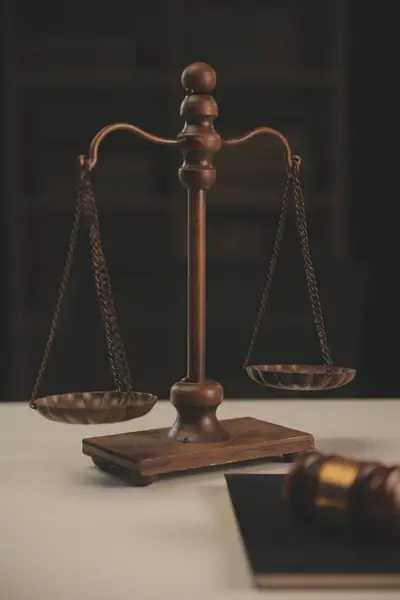 image of judge\'s hammer, scales lady of justice, law book, laptop computer and contract documents with pen concept of law and justice.