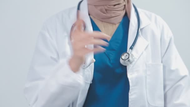 Female Doctor Uniform Showing Sign Grey Background — Stock Video
