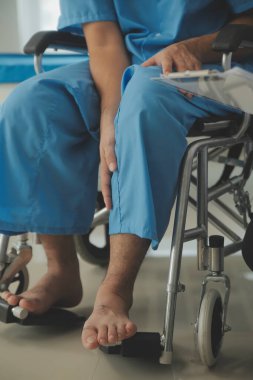 young asian physical therapist working with senior woman on walking with a walker