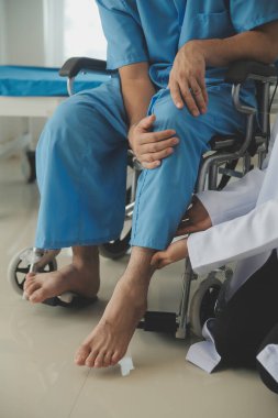 young asian physical therapist working with senior woman on walking with a walker
