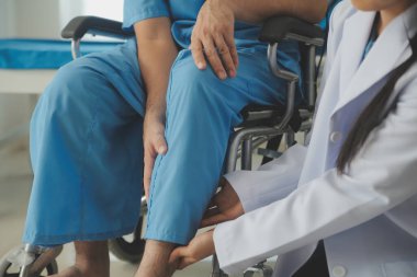 young asian physical therapist working with senior woman on walking with a walker