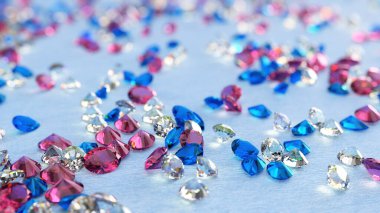 Blue, Pink And Colorless Topaz On Light Blue Background clipart