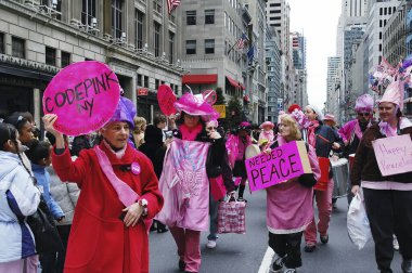 Anti-war 'Code Pink' demonstrators taking part in the Easter Parade on 5th avenue in New York City. March 27, 2005 - New York, USA clipart