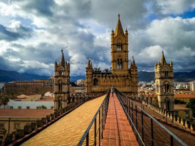 Palermo, Sicily, Italy. 10 January 2018: A view from the rooftop of the Palermo Cathedral in Sicily, Italy, looking towards the city and surrounding mountains. clipart