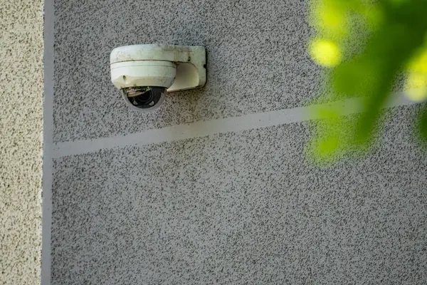 stock image White Security Camera Mounted On Exterior Wall Of Building