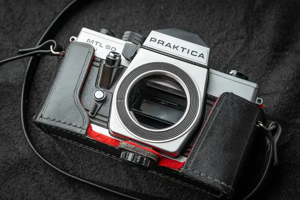 stock image Vintage Praktica mtl 50 Silver and Black Camera With Leather Case on Black Surface