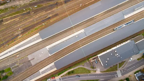 stock image Aerial view of a railway station with trains at platforms during the day