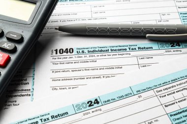 Filing the 2024 US 1040 individual income tax form with calculator and pen clipart