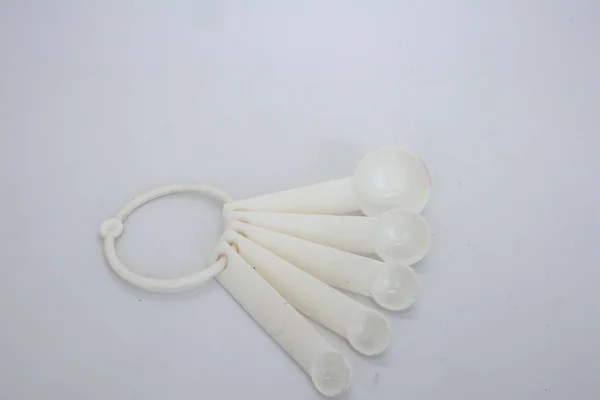 A set of cake spoons for cake decorating needs isolated on white