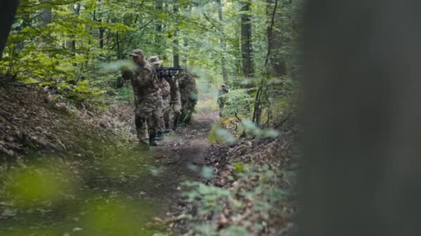 Military Squad Walking Cautiously Forest Path — Stock Video