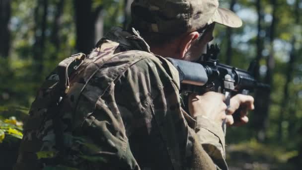 Skilled Soldier Holding His Rifle Ready Shoot Position Forest — Stock Video