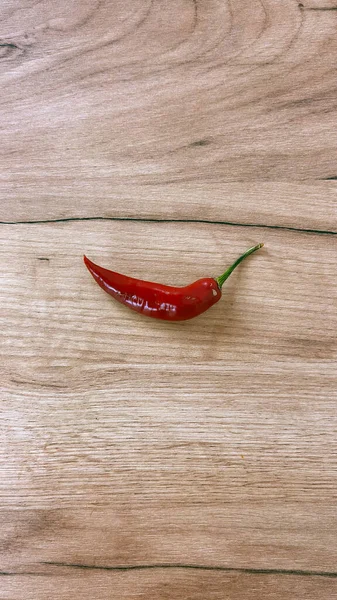 Dry chili peppers ON A WOODEN TABLE