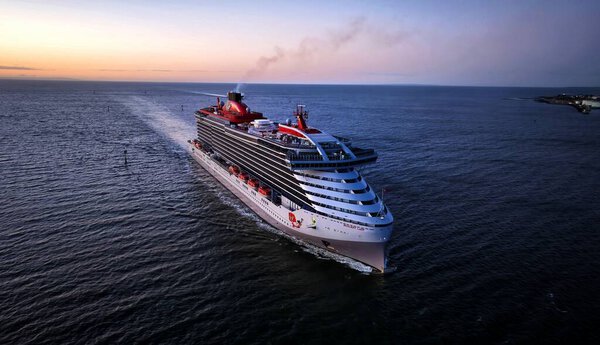 Melbourne, VIC, Australia - 23-Dec-2023 - The Resilient Lady cruise ship from Virgin Voyages arriving in Port Melbourne at sunrise