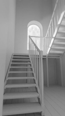 Üç boyutlu, kemerli tuğla duvarlı, geniş pencereli ve ahşap merdivenli eski bir oda. Atmosferik ışık çarpıcı bir endüstriyel klasik mimari iç mekan yaratıyor..