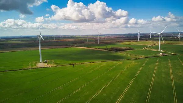 stock image Aerial 4k Wind turbine renewable energy fields UK farmland HDR