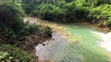 Point of view of huge waterfalls, tropical jungle and blue mountain waters, travelling Asia, Philippines, vacation holiday, green biodiversity, scenic 